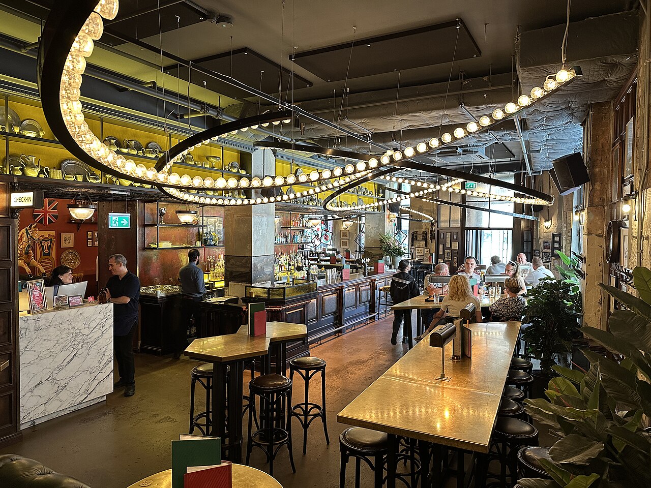 Inside Flight Club Shoreditch: the check-in desk and bar area